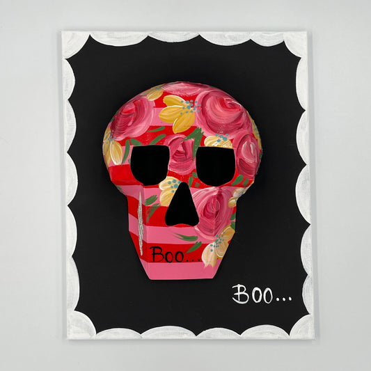 Skull and bloom motif in retro-inspired wall art frame