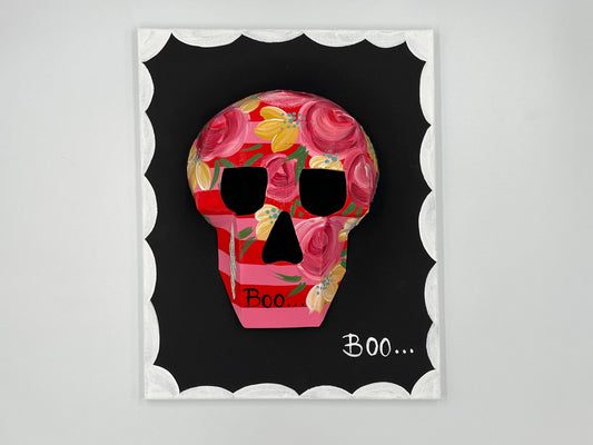 Skull and bloom motif in retro-inspired wall art frame